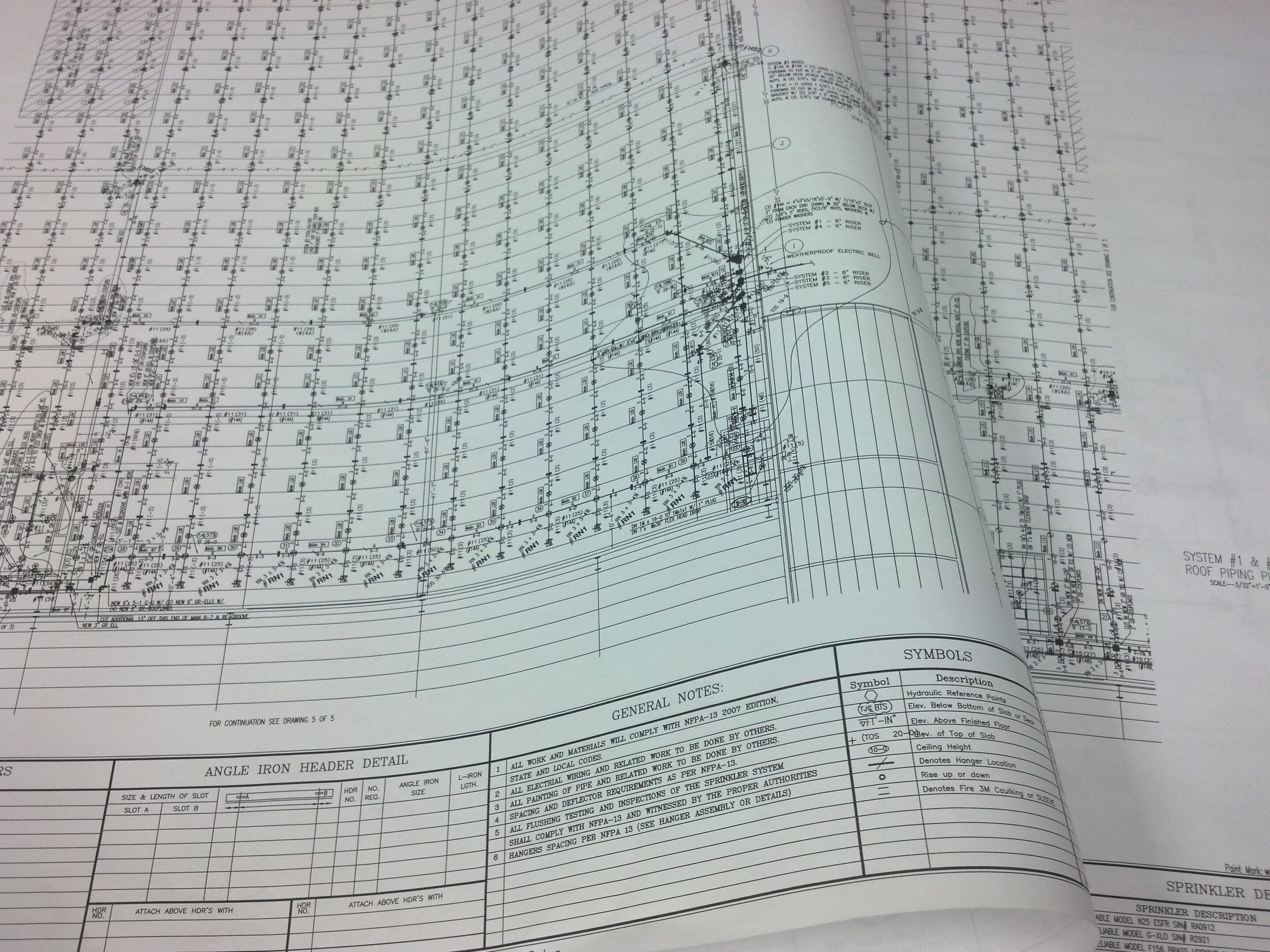 Architectural blueprint showing detailed floor plans and notes.